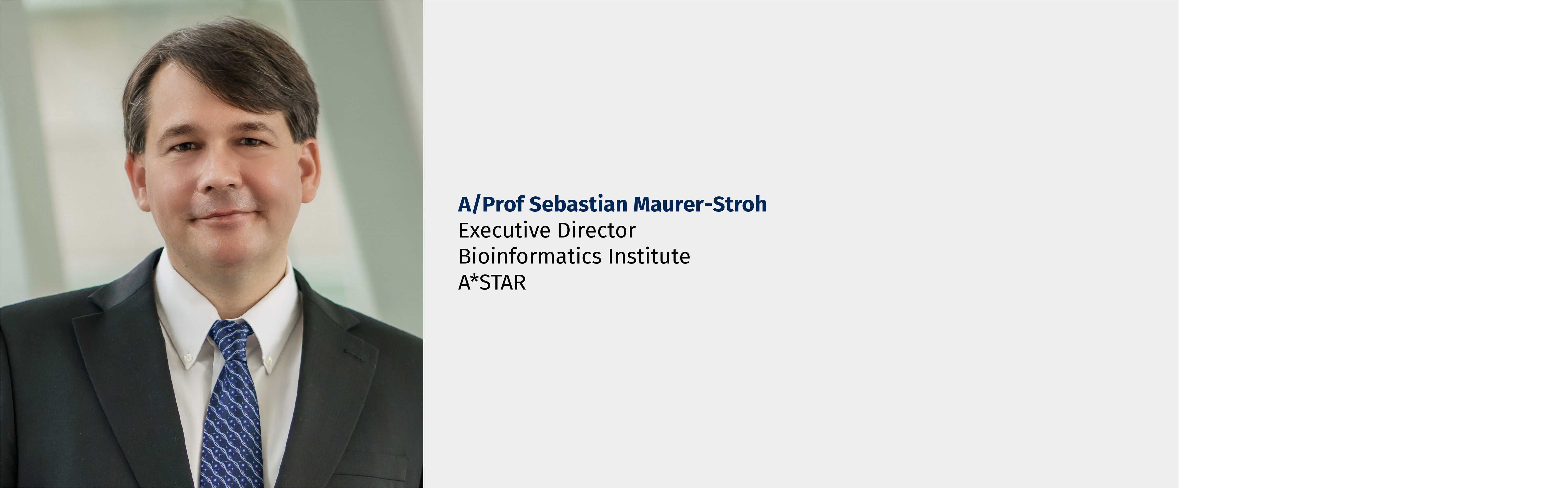 Man in suit and blue tie; text: A/Prof Sebastian Maurer-Stroh, Executive Director, Bioinformatics Institute, A*STAR